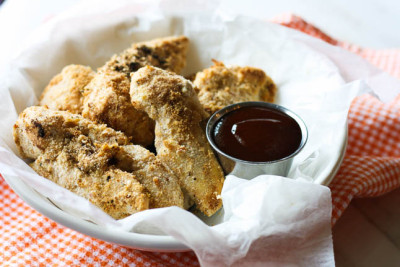 Healthy Baked Chicken Fingers with BBQ Dipping Sauce- a healthy, gluten-free version of the fried chicken fingers we love! | adoubledose.com