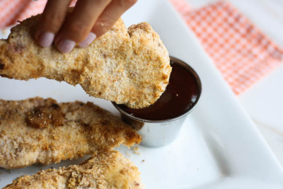 Healthy Baked Chicken Fingers with BBQ Dipping Sauce- a healthy, gluten-free version of the fried chicken fingers we love! | adoubledose.com