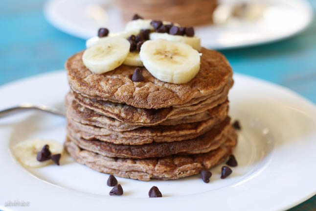 Banana Chocolate Chip Pancakes - the fluffiest, gluten free pancakes stuffed with warm chocolate chips and topped with sliced banana | adoubledose.com