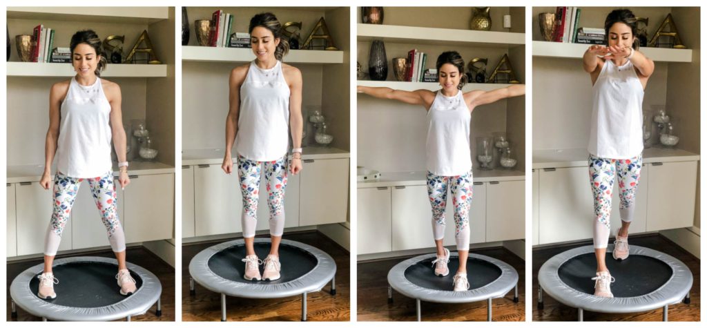 fitness blogger using a small rebounder/mini trampoline in floral printed workout leggings from Fabletics and a white tank sharing a workout at home | adoubledose.com