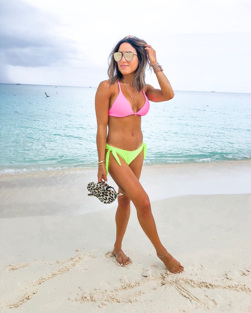 fashion blogger wearing neon bikini on seven mile beach grand cayman