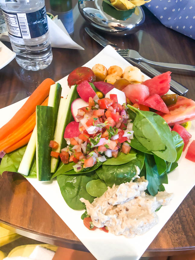 spinach, carrots, cucumbers and fresh vegetables with hummus at the club at the ritz carlton grand cayman