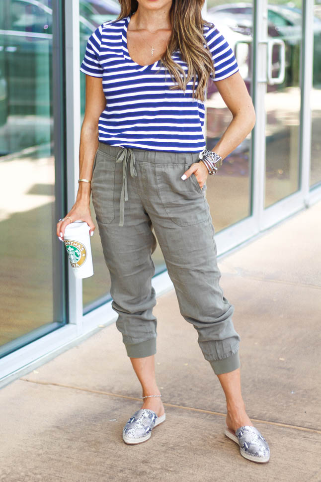 fashion and lifestyle blogger samantha belbel of adoubledose.com wearing olive green linen joggers with a striped short sleeved tee and snakeskin mules from Nordstrom 