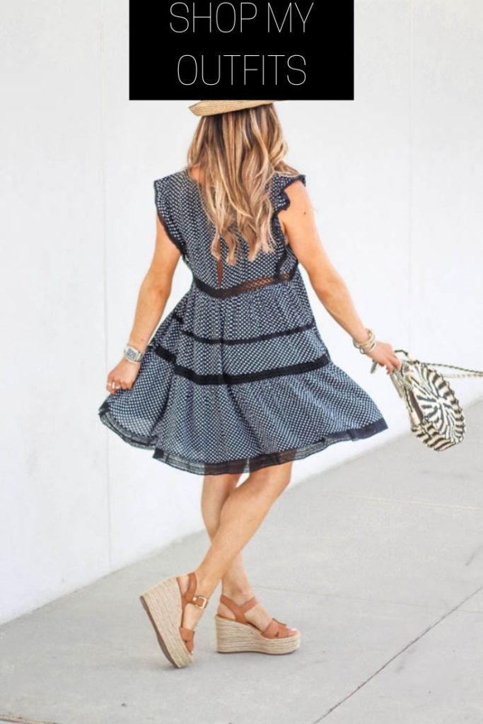 fashion blogger wearing navy free people tiered dress, sam edelman wedges and a round straw bag from sole society