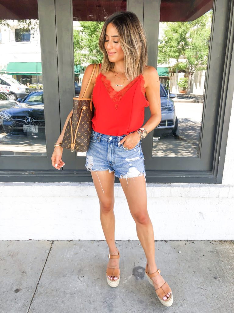 fashion and lifestyle blogger alexis belbel wearing a red lace cami from shein and ripped denim shorts from abercrombie with sam edelman espadrille wedges