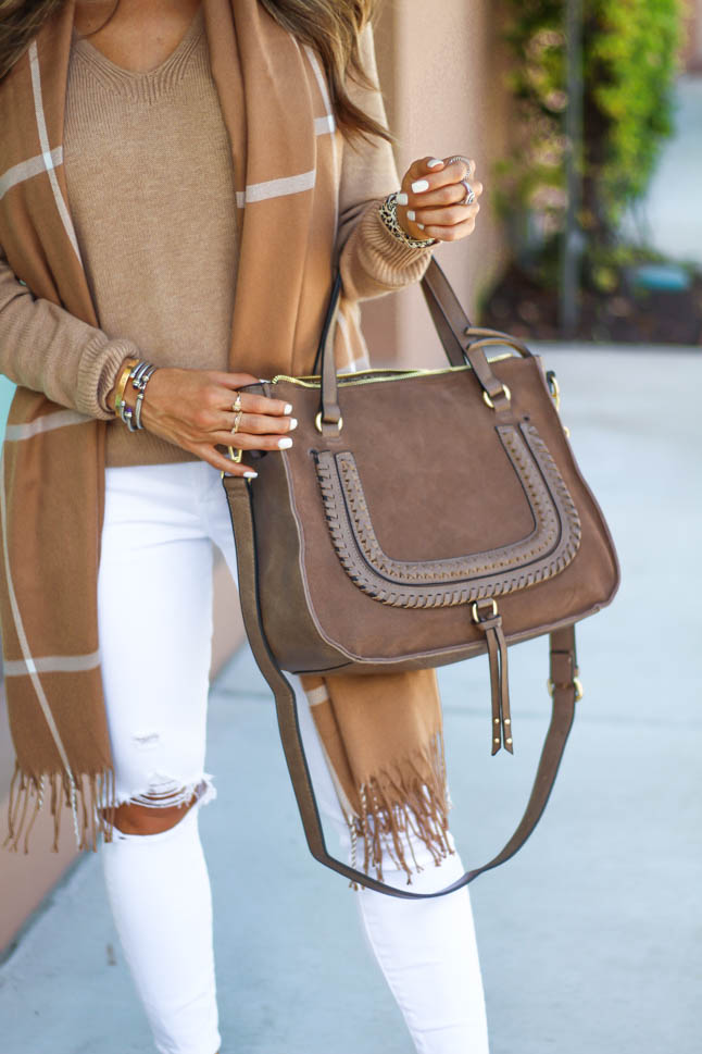 lifestyle and fashion blogger samantha belbel of a double dose wearing a tan neutral sweater from express with white jeans with rips, a neutral windowpane fringe scarf, a suede satchel bag from sole society, and snakeskin python pointed flats for a fall outfit