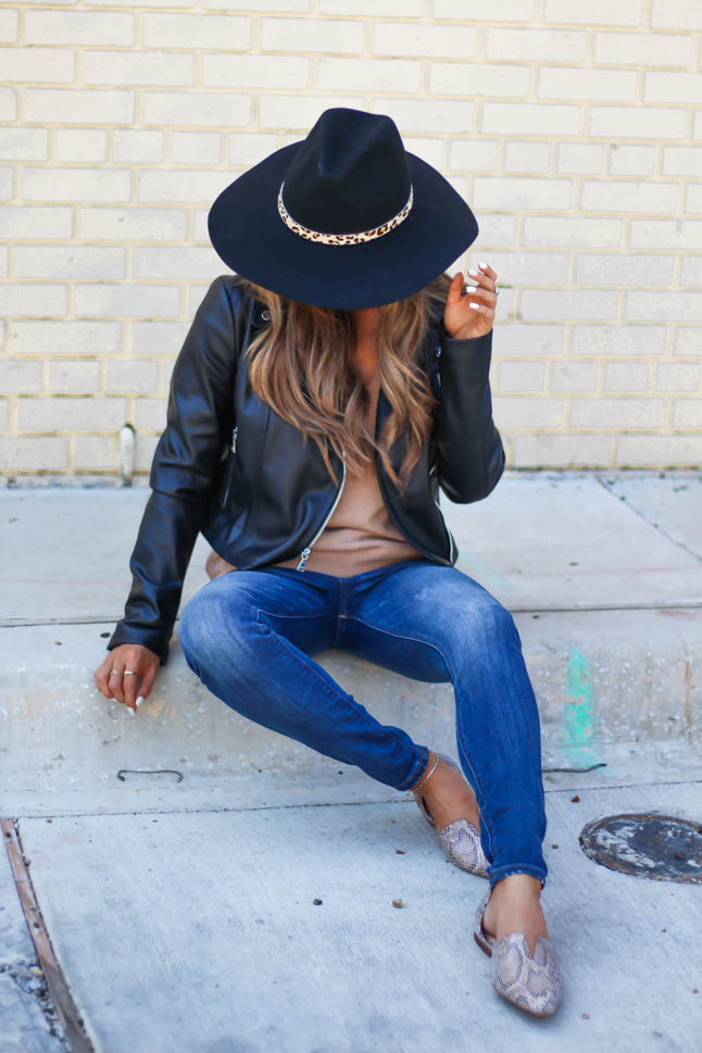 lifestyle and fashion blogger samantha belbel of a double dose wearing a faux leather moto jacket with a tan sweater, dark skinny jeans from Express, a black wool hat for fall and snakeskin printed pointed flats 