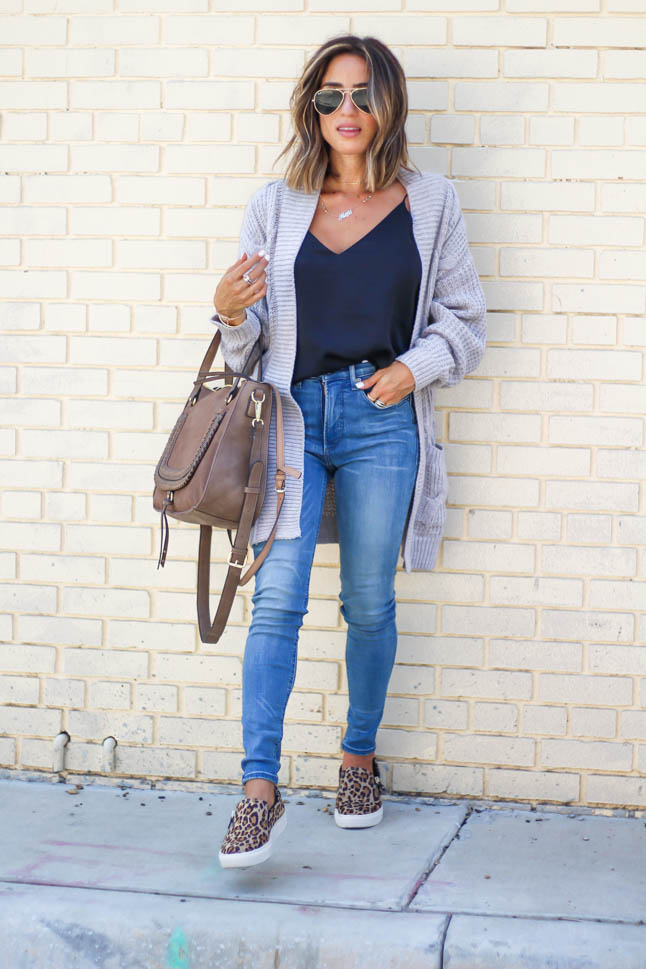 lifestyle and fashion blogger, alexis belbel, of A Double Dose, wearing stretchy jeans for petites from express with a cable knit cardigan and a silk camisole with Dr. Scholl's leopard slip on sneakers from shoes.com