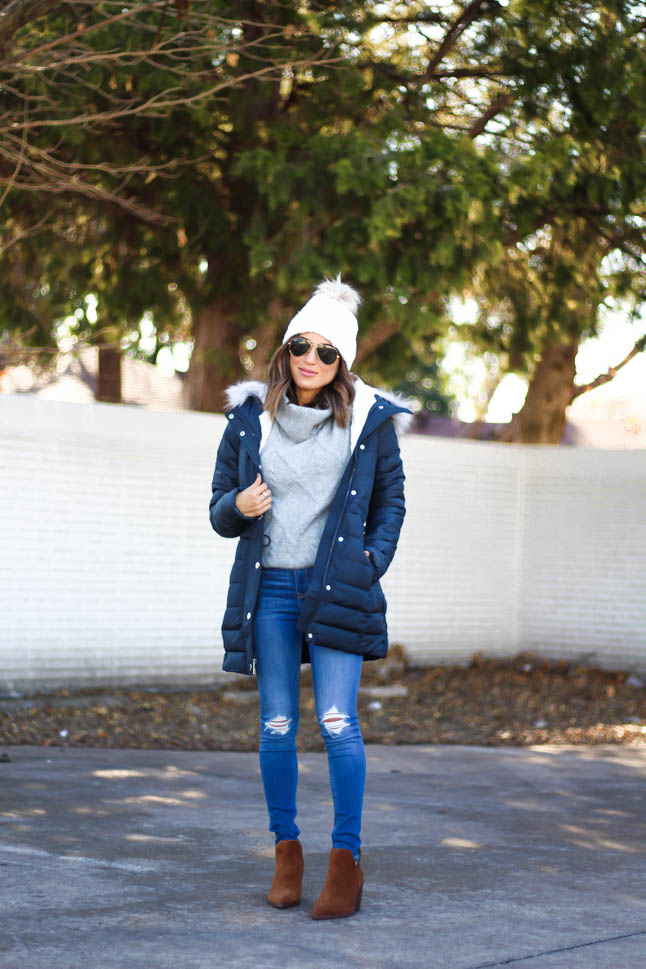 lifestyle and fashion blogger alexis belbel wearing sherpa parka jacket from hollister in black, grey cable turtleneck sweater from hollister, ripped legging jeans from hollister co, brown suede booties from vince camuto, white pom pom cable beanie from hollister | adoubledose.com