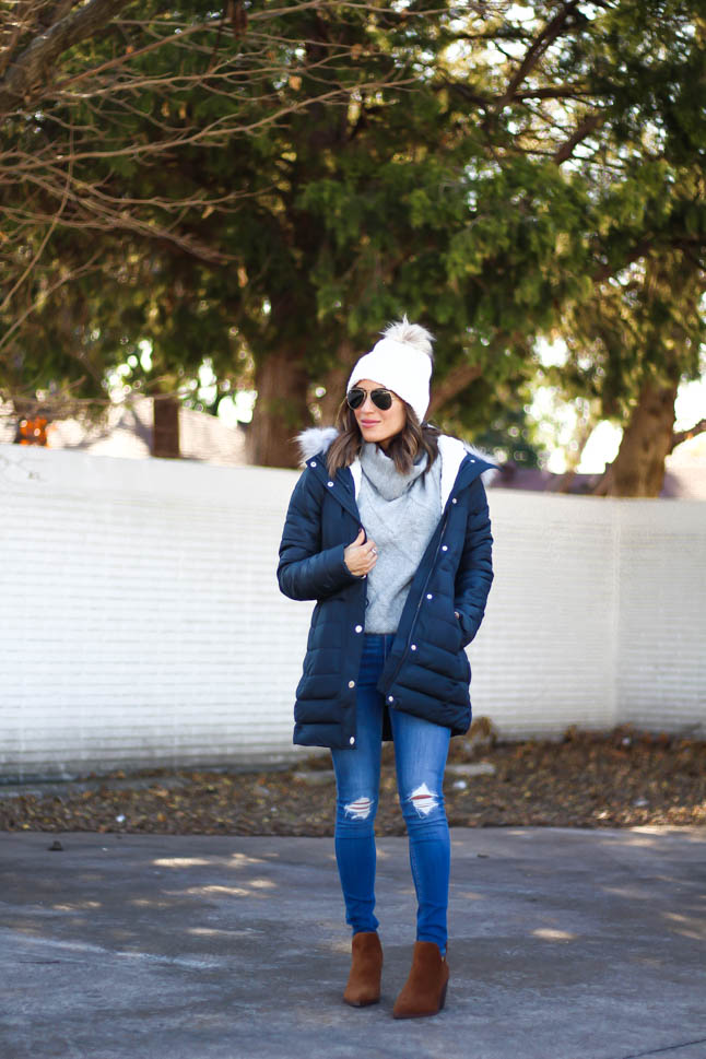 lifestyle and fashion blogger alexis belbel wearing sherpa parka jacket from hollister in black, grey cable turtleneck sweater from hollister, ripped legging jeans from hollister co, brown suede booties from vince camuto, white pom pom cable beanie from hollister | adoubledose.com