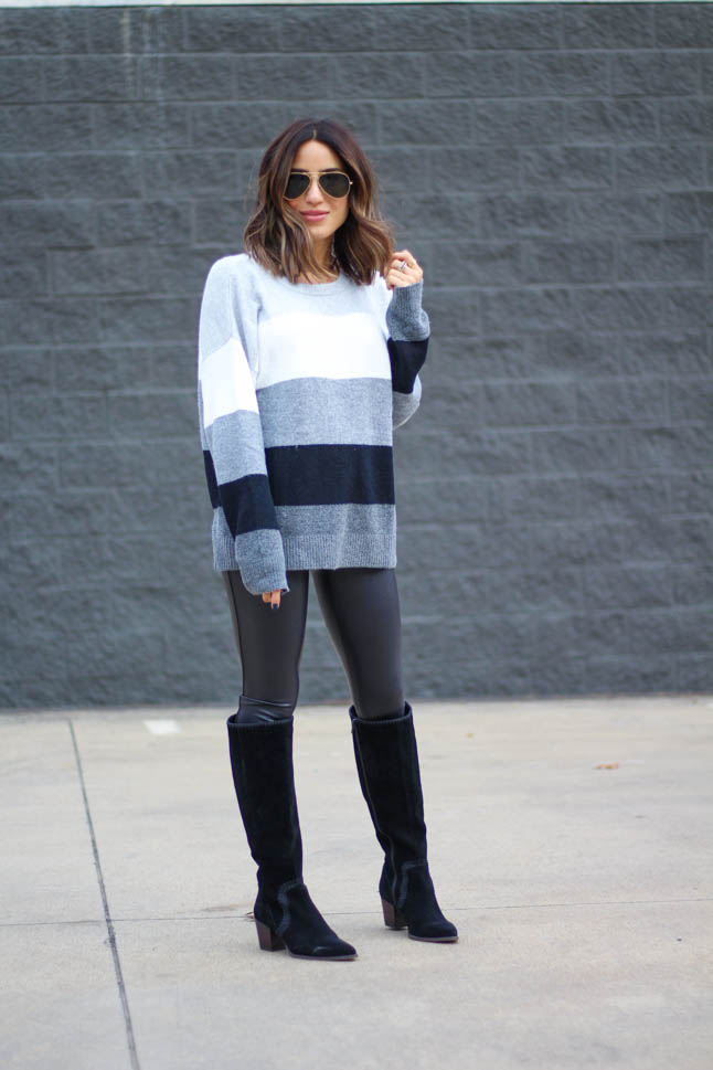 lifestyle and fashion blogger alexis belbel wearing grey, black, and white colorblock sweater from Walmart with faux leather leggings and black suede boots | | adoubledose.com