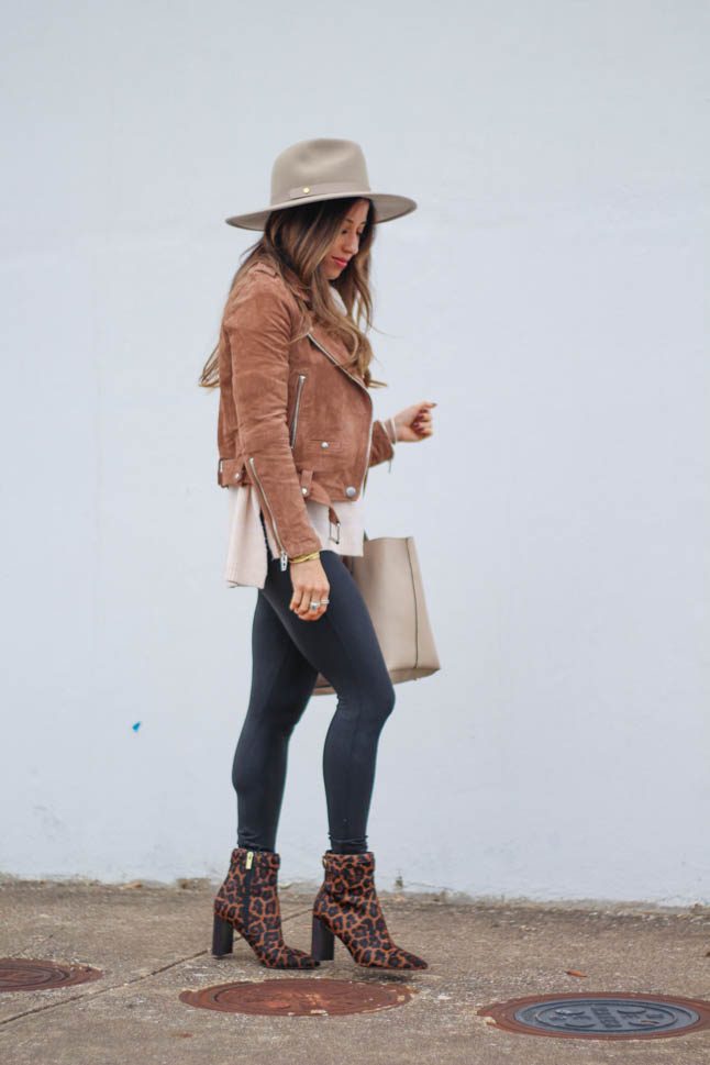 lifestyle and fashion blogger samantha belbel wearing leopard pointed booties from sole society, suede moto jacket from blanknyc, spanx faux leather leggings and a neutral floppy hat | adoubledose.com