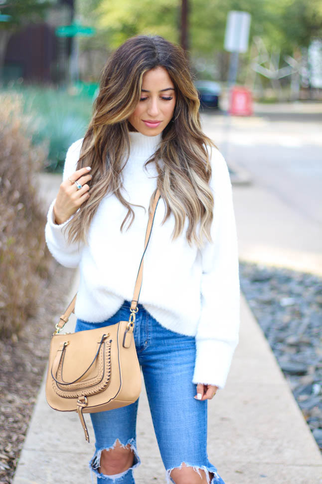lifestyle and fashion blogger samantha belbel wearing a cozy ivory turtleneck sweater from revolve with levis ripped jeans, leopard sneaker mules from sole society, satchel crossbody bag from sole society, and a neutral scarf | adoubledose.com