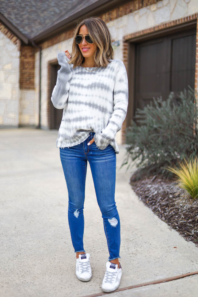 lifestyle and fashion blogger alexis belbel shares a spring transitional look from walmart fashion wearing skinny distressed jeans from sofia jeans and a tie dye thermal top from sofia jeans and golden goose sneakers| adoubledose.com