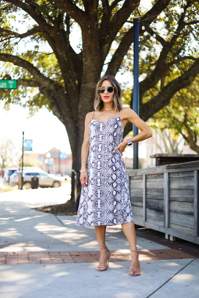 lifestyle and fashion blogger alexis belbel sharing four ways to style a snakeskin print dress from express and nude heels from steve madden| adoubledose.com