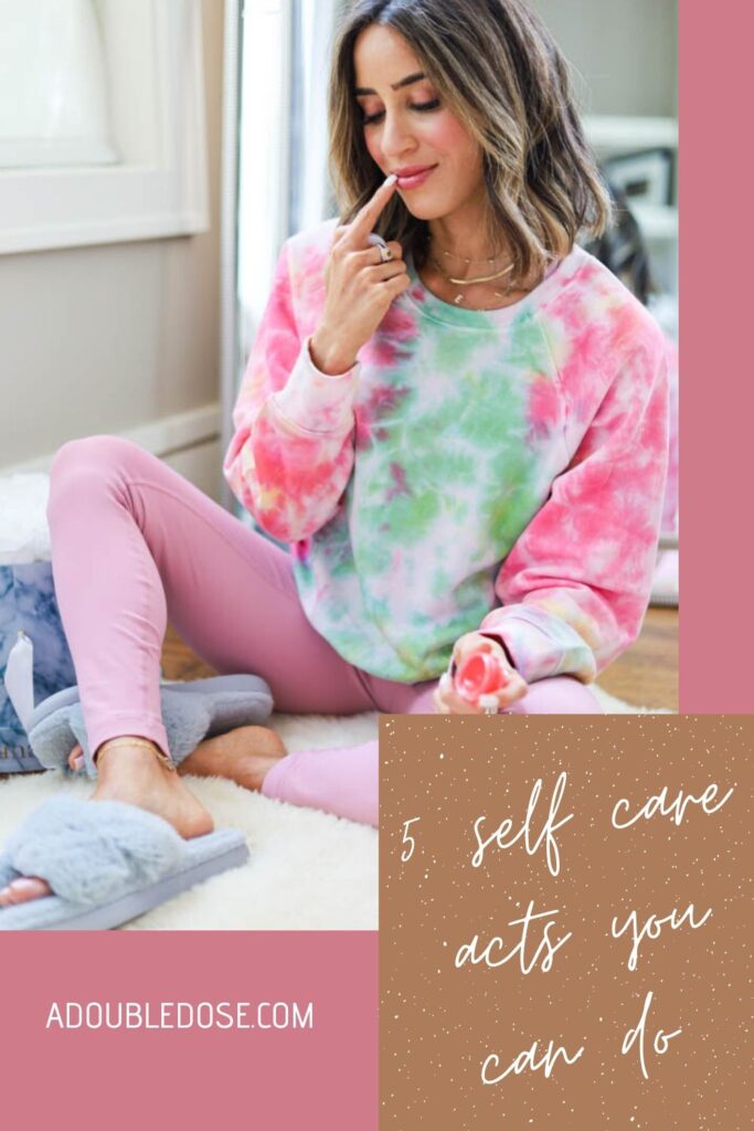 lifestyle and fashion blogger, alexis belbel wearing a tie dye sweatshirt, pink leggings, cozy slippers shares 5 Self Care Acts You Can Do During Quarantine, including awake beauty lip masks, face masks, facial exfoliators/scrubs, a back massage, and candles. | adoubledose.com