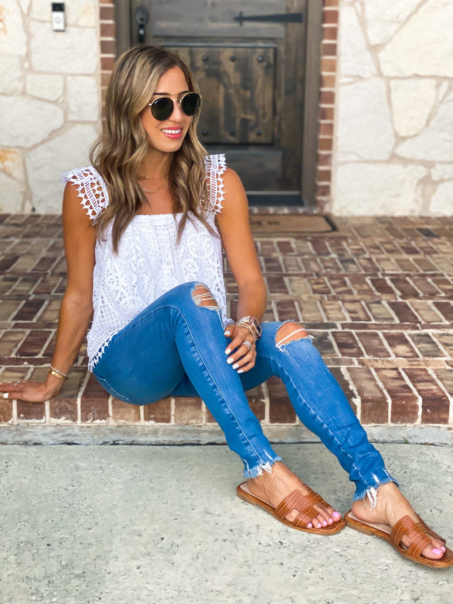 lifestyle and fashion blogger alexis belbel sharing how to style green shorts with a denim jacket and lace bodysuit from express and a white lace top with ripped skinny jeans for petites | adoubledose.com