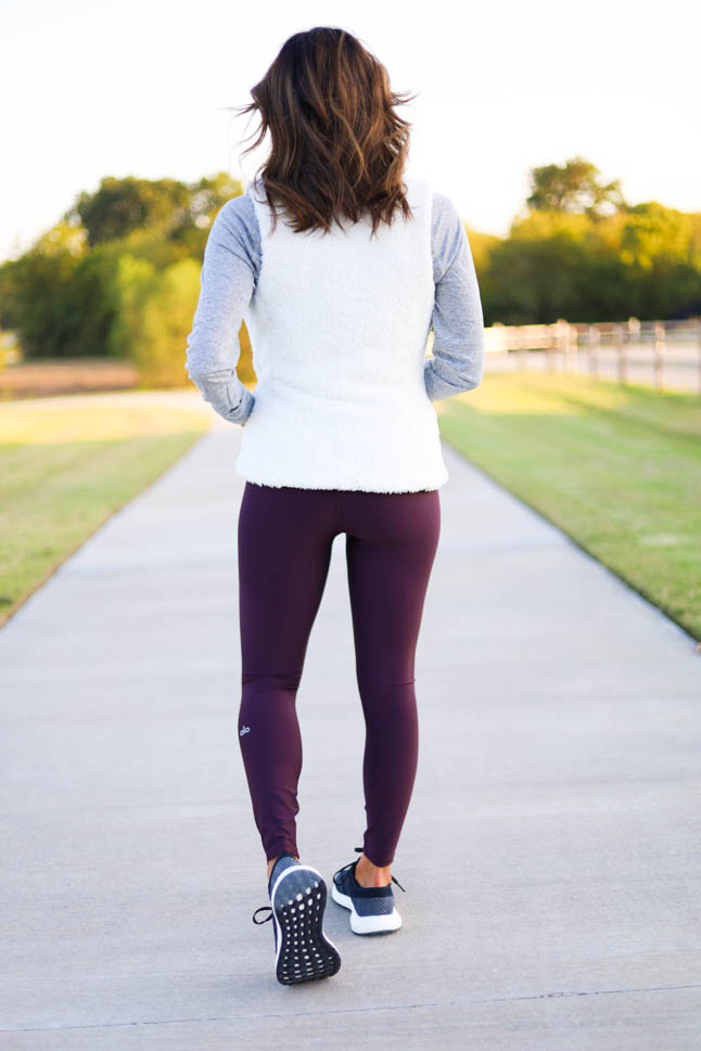 lifestyle and fashion blogger alexis belbel sharing a fall walking outfit from backcountry wearing a patagonia los gatos vest with alo airlift leggings and sharing benefit of walking outdoors | adoubledose.com