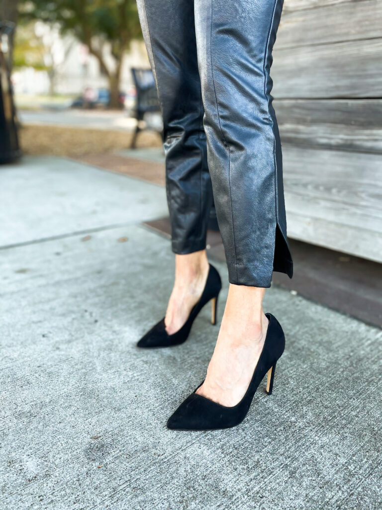 10 Things We Have Learned in 2020 wearing faux leather pants from expess with a cowl neck sweater and black pumps nye outfit idea | adoubledose.com