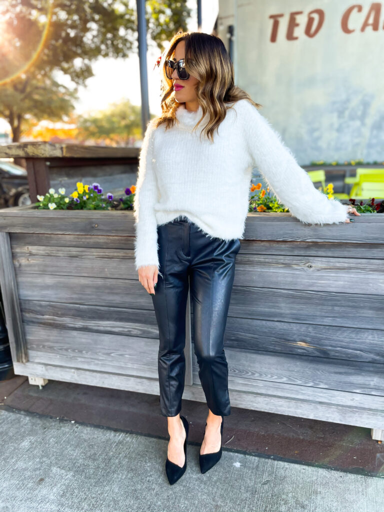 10 Things We Have Learned in 2020 wearing faux leather pants from expess with a cowl neck sweater and black pumps nye outfit idea | adoubledose.com