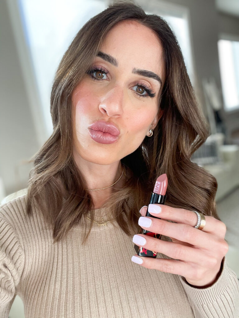 lifestyle and fashion blogger alexis belbel sharing her favorite nude lipstick from NARS available at Nordstrom wearing a sweater dress and snakeskin booties | adoubledose.com