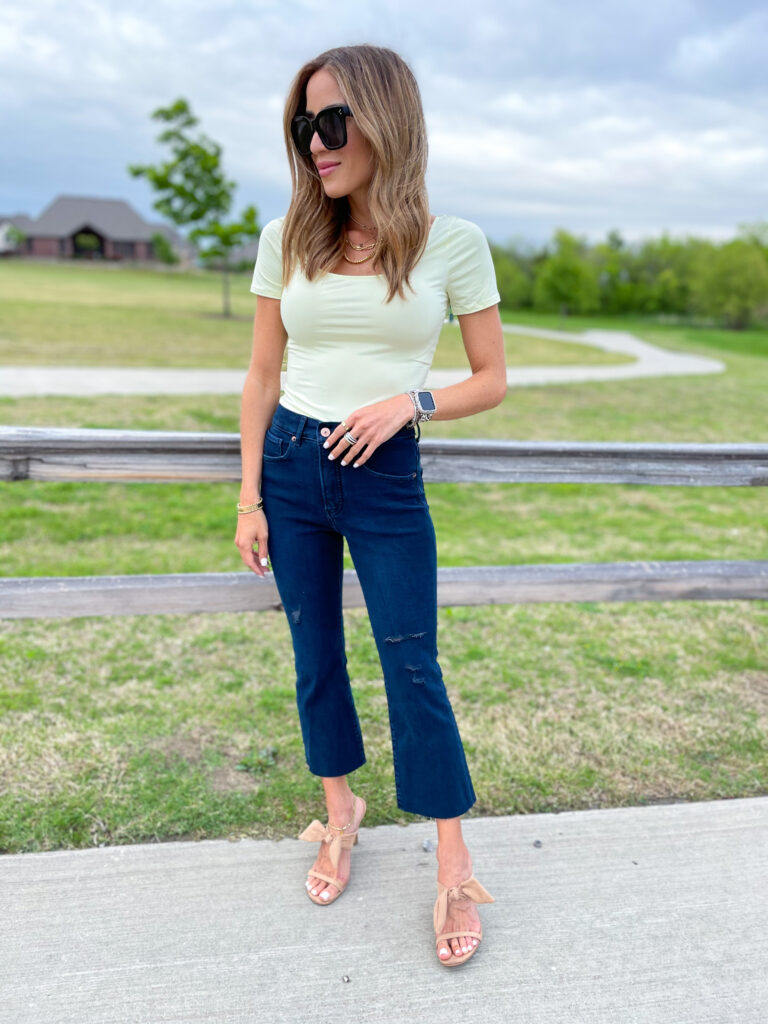 lifestyle and fashion bloggers alexis and samantha belbel share their favorite cropped flare jeans for petites from express and how to style them - with a bodysuit and black tank | adoubledose.com